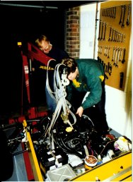 Peter C and Andrew Winfer with engine in car 1